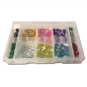 Clear plastic box with sections showing an assortment different fuses in a range of colours